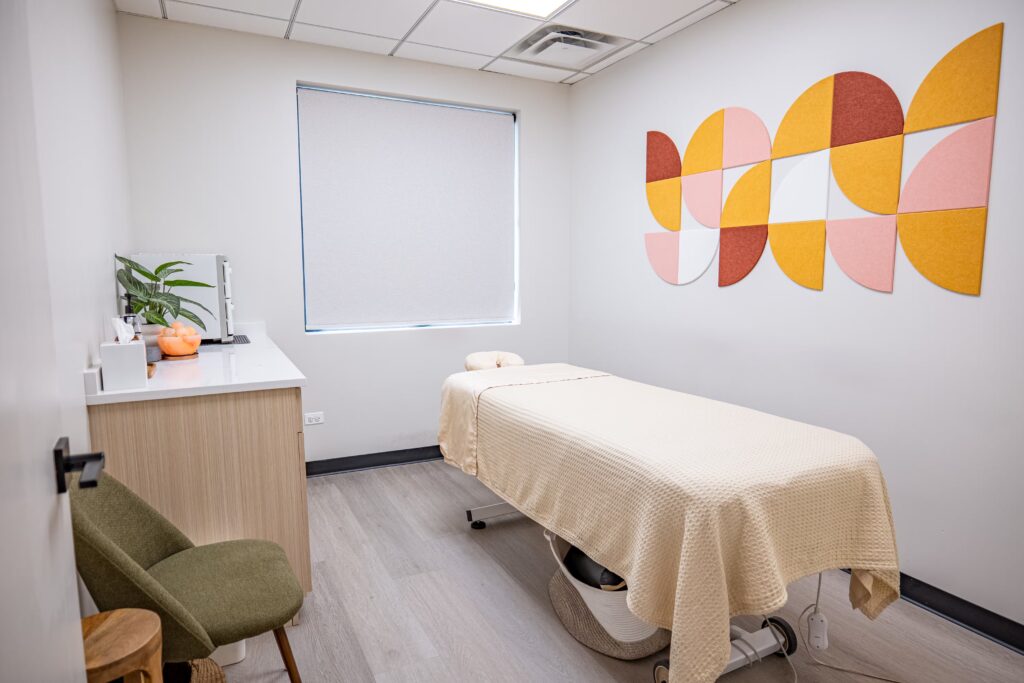 Photoshoot: Practitioner performing acupuncture at a North Shore wellness clinic